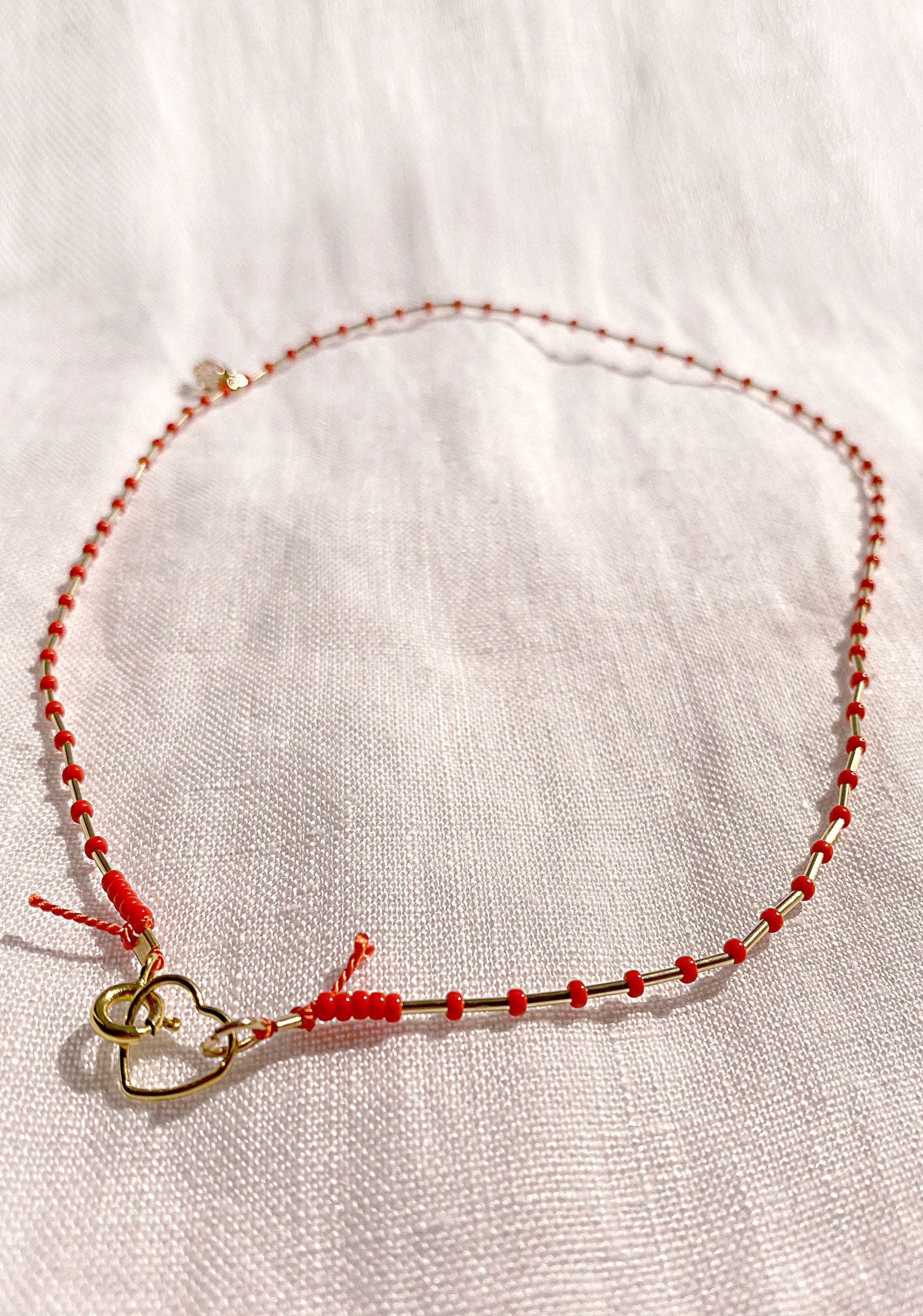 Red string outlet necklace